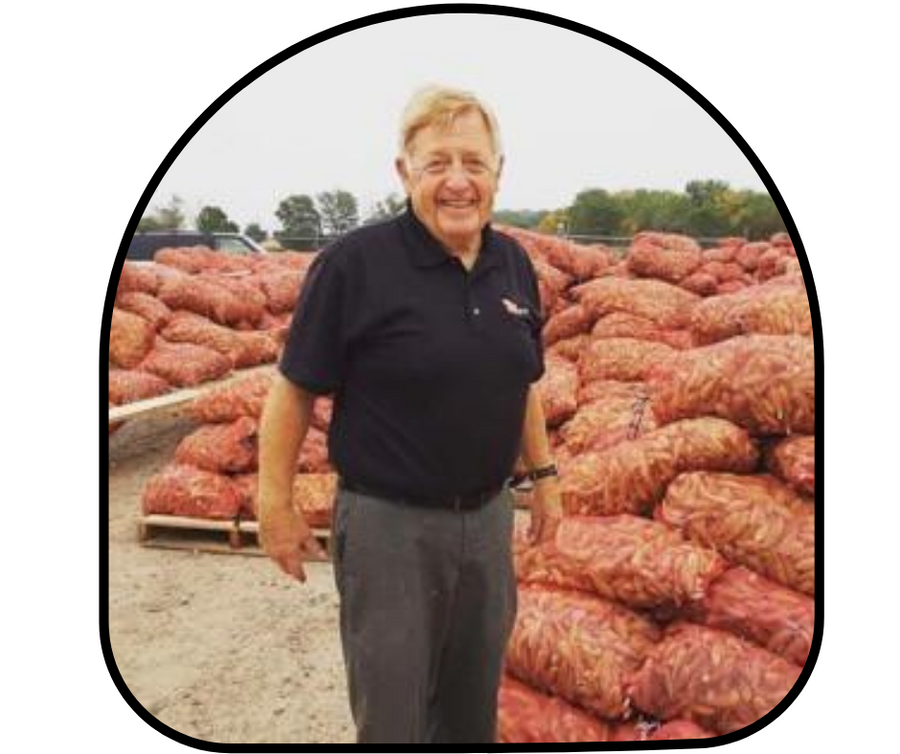 Herb Knudsen with harvested milkweed pods